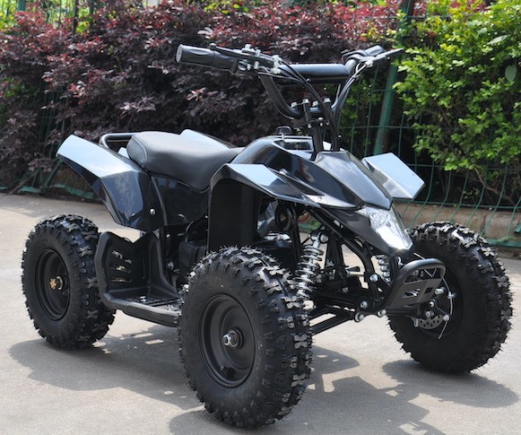 Child on electric ATV outdoors