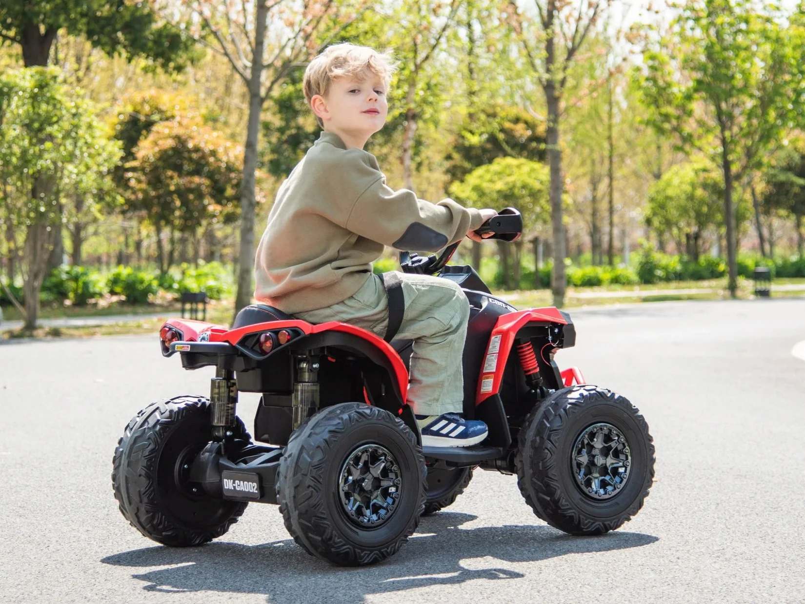 Kid riding electric ATV on trail
